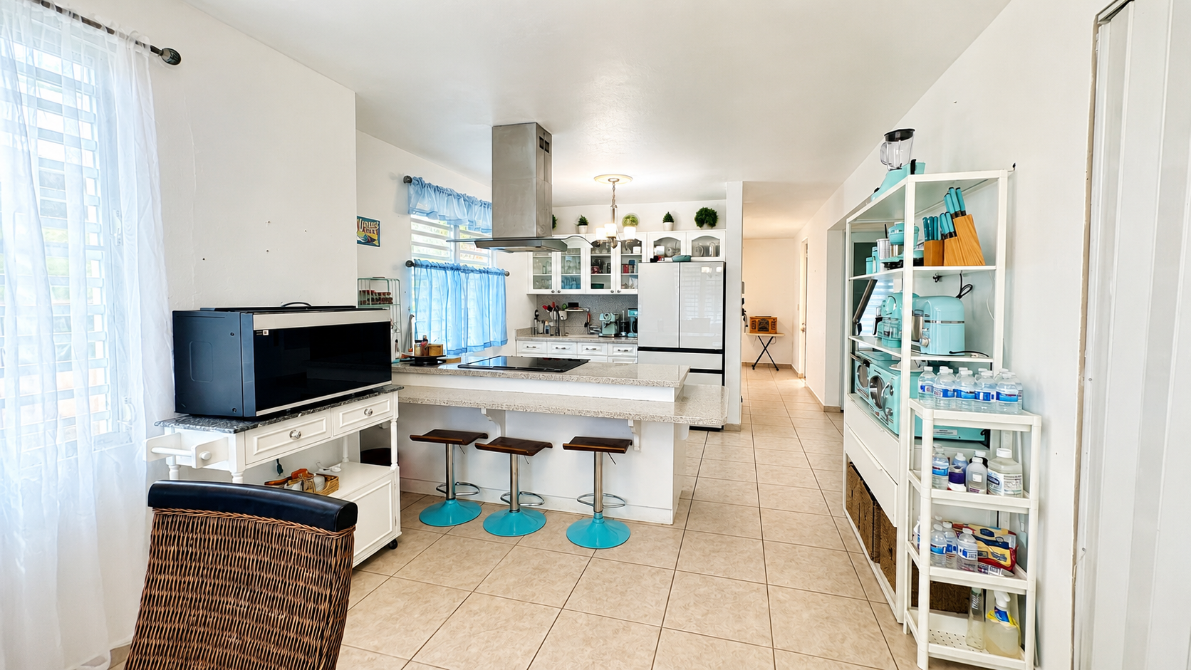 Open kitchen with island and breakfast bar